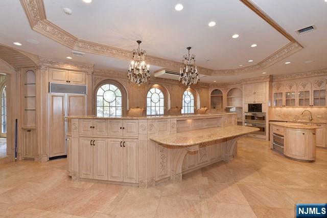 101 Fox Hedge Road Saddle River, NJ 07458 - Photo 9 of 21 a view of a kitchen with refrigerator and mirror