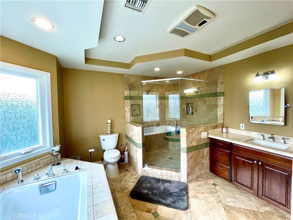 1142 Paloma Drive Arcadia, CA 91007 - Photo 28 of 42 a spacious bathroom with a double vanity sink a large mirror and a bathtub