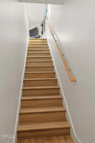 a kitchen with cabinets stainless steel appliances and a sink