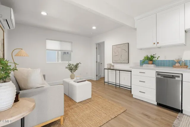 a bedroom with a bed and a potted plant