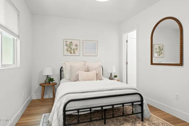 a view of a water with boats and trees in the background