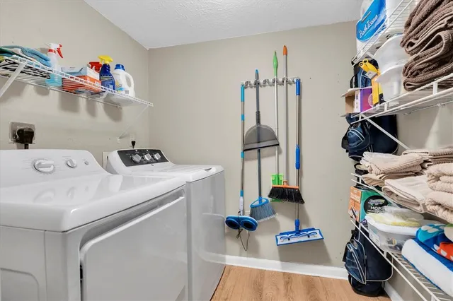 a view of a hallway with furniture and floor to ceiling window