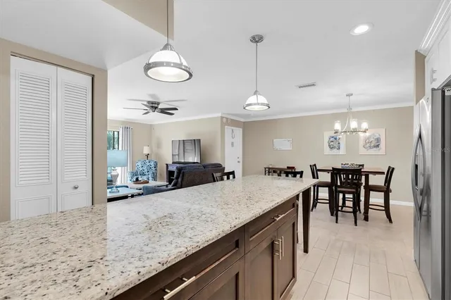 a view of a dining room with furniture and chandelier