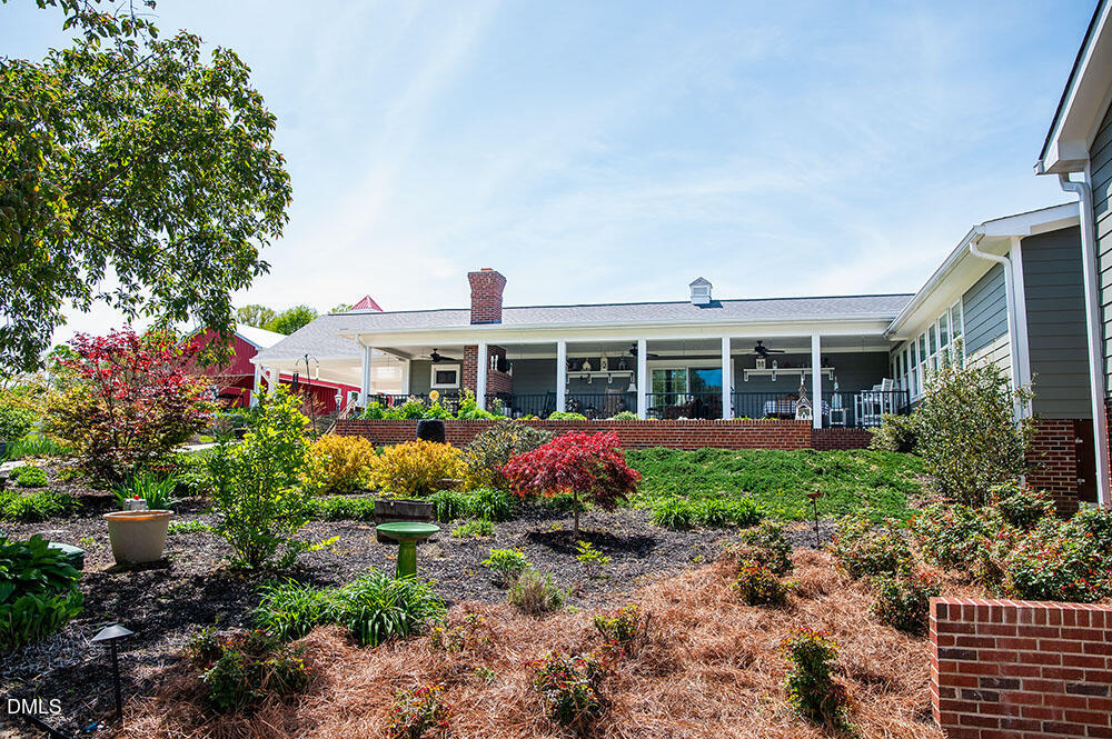 75 Frank Timberlake Road Timberlake, NC 27583 - Photo 68 of 93 a front view of a house with garden