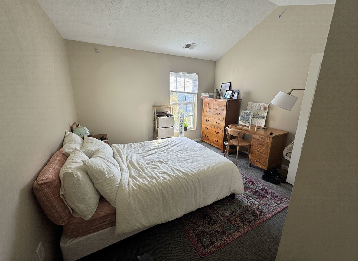 1905 North Lincoln Avenue, Unit 319 Urbana, IL 61801 - Photo 5 of 10 a bedroom with a bed and wooden floor