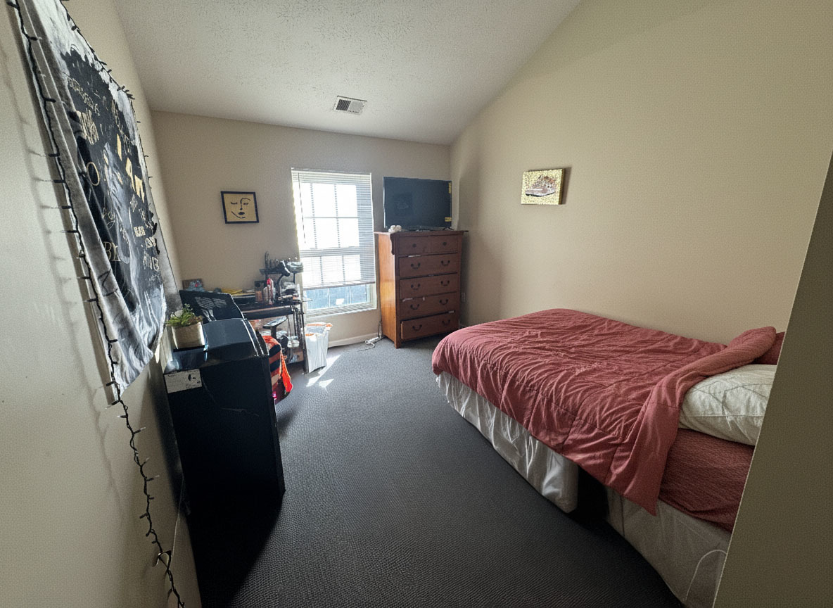 1905 North Lincoln Avenue, Unit 319 Urbana, IL 61801 - Photo 8 of 10 a bedroom with a bed closet and a flat tv screen