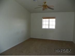 3883 North Verde Road Golden Valley, AZ 86413 - Photo 5 of 10 an empty room with a window