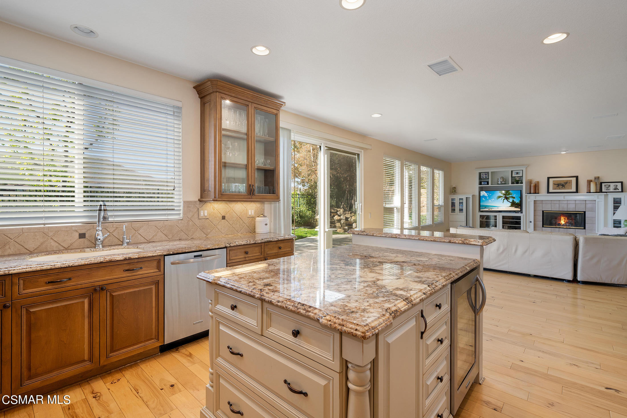 346 Woodland Road Simi Valley, CA 93065 - Photo 4 of 14 a kitchen with granite countertop a sink and a center island