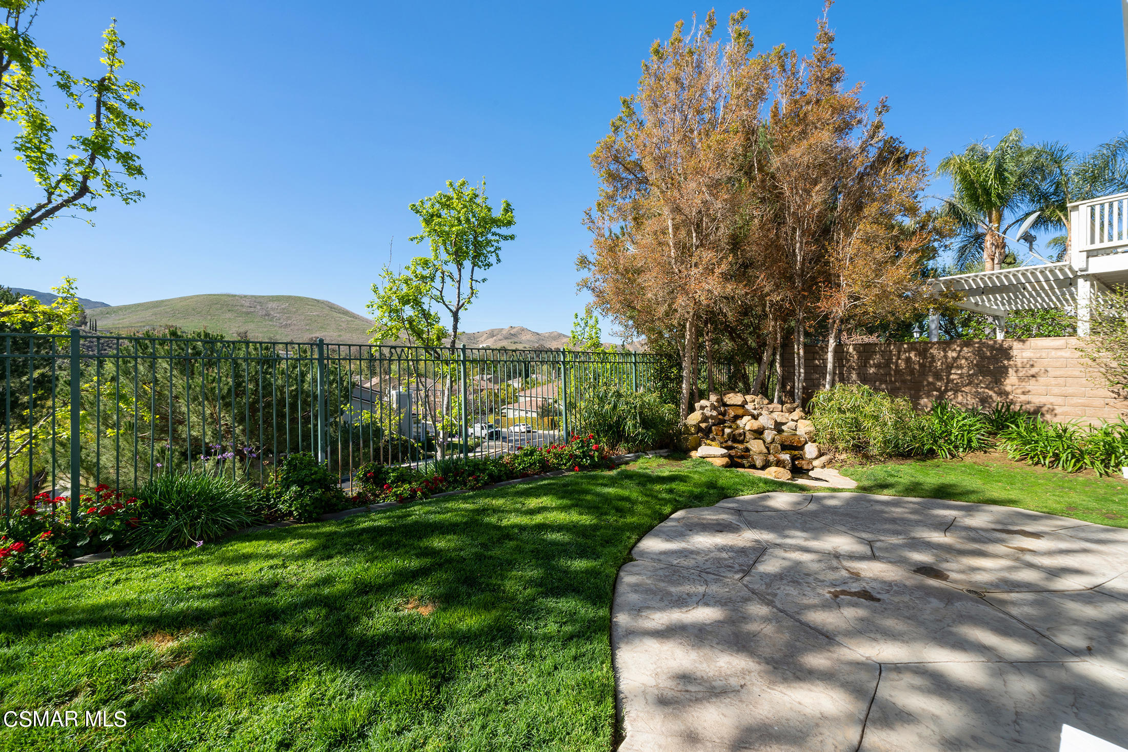 346 Woodland Road Simi Valley, CA 93065 - Photo 5 of 14 a view of a garden with a building in the background