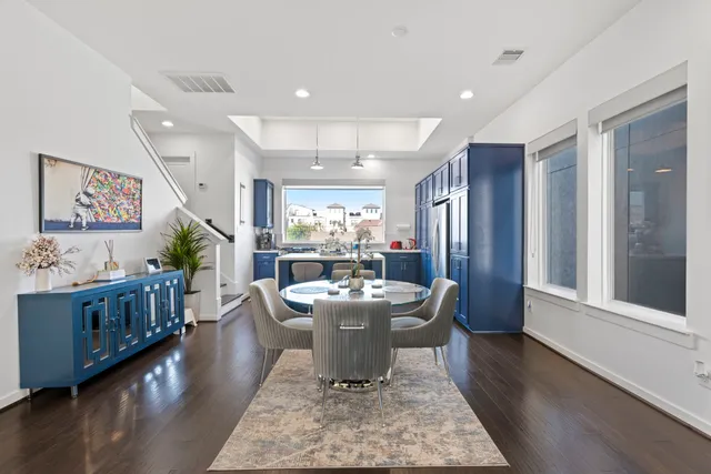 a bathroom with a granite countertop sink a toilet and shower curtain