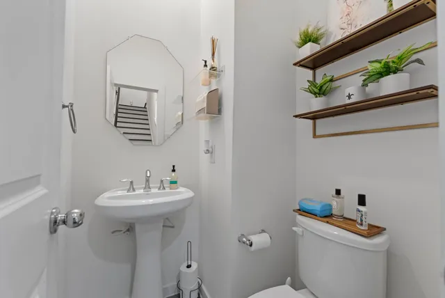 a spacious bedroom with a bed and wooden floor