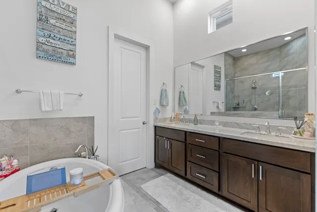 a bathroom with a sink and shower