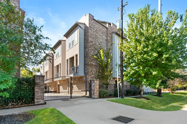 a view of a street with a building in the background