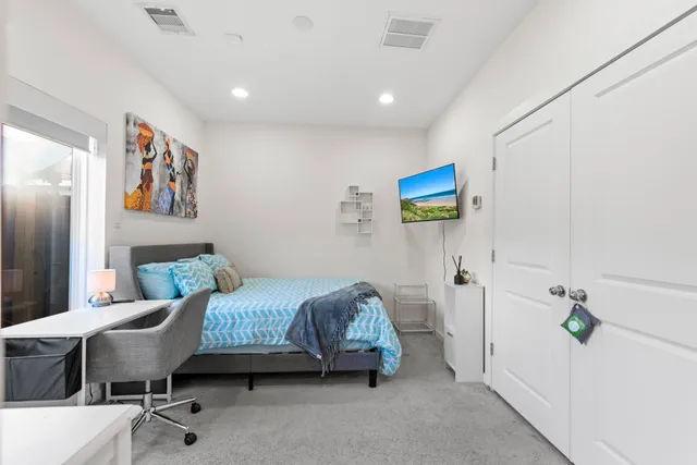 a bedroom with a bed and furniture