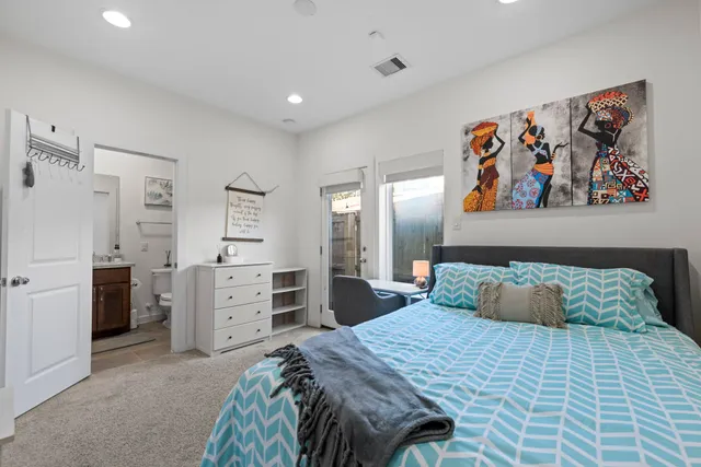 a bedroom with a bed and a cabinets