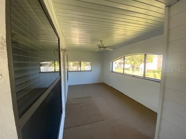 a view of an empty room and window