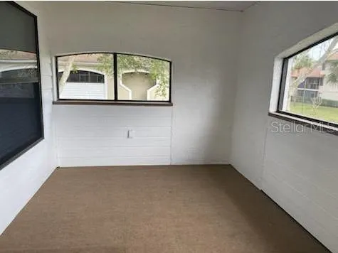 an empty room with windows