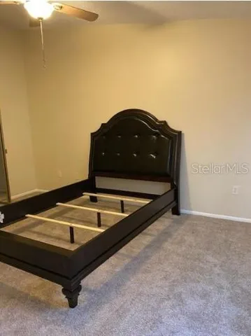 a room with a table and a potted plant