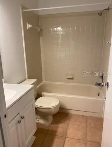 a bathroom with a toilet a sink and bathtub