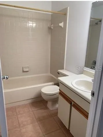 a bathroom with a sink a toilet and a bathtub