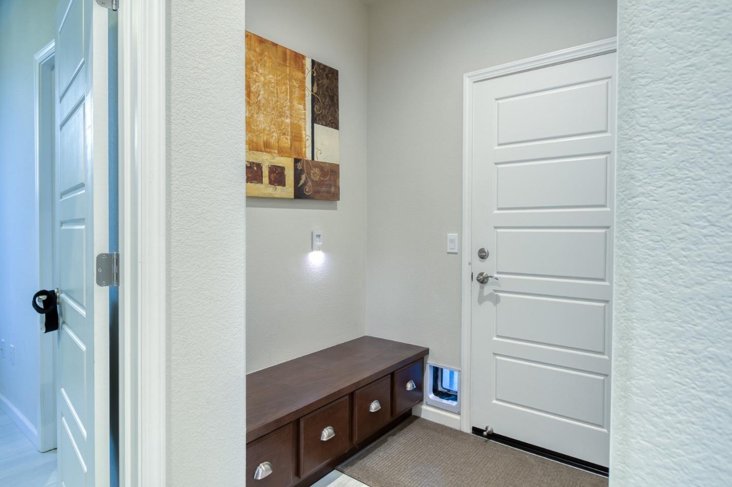 4341 Trailblazer Way Modesto, CA 95356 - Photo 25 of 27 a room with a closet and a cabinet