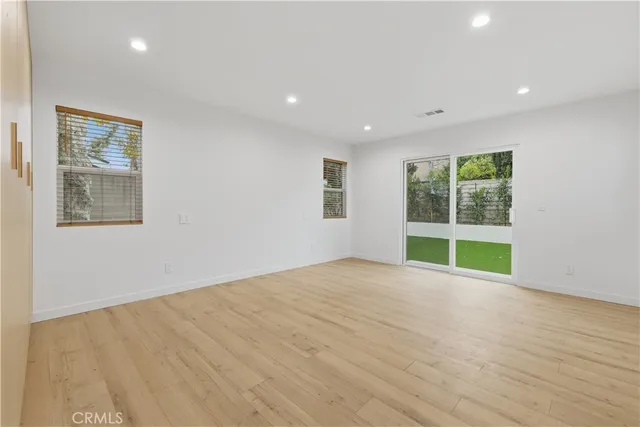 closeup of a sink a mirror and a toilet