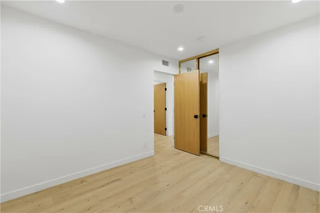 a bathroom with a sink a shower a mirror and a shower