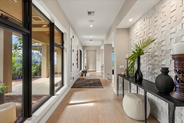 a lobby with furniture and floor to ceiling window