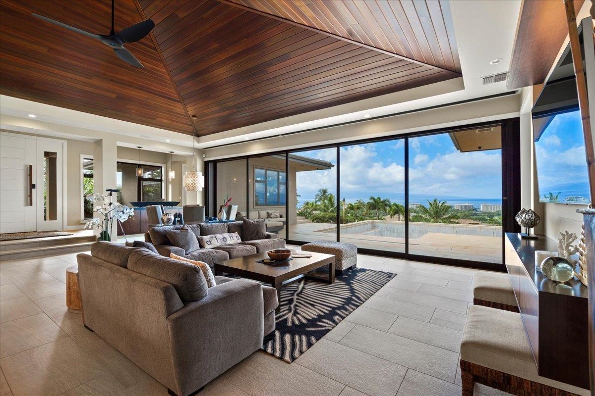 44 Anapuni Loop, Unit 3 Lahaina, HI 96761 - Photo 15 of 49 a living room with furniture and a floor to ceiling window