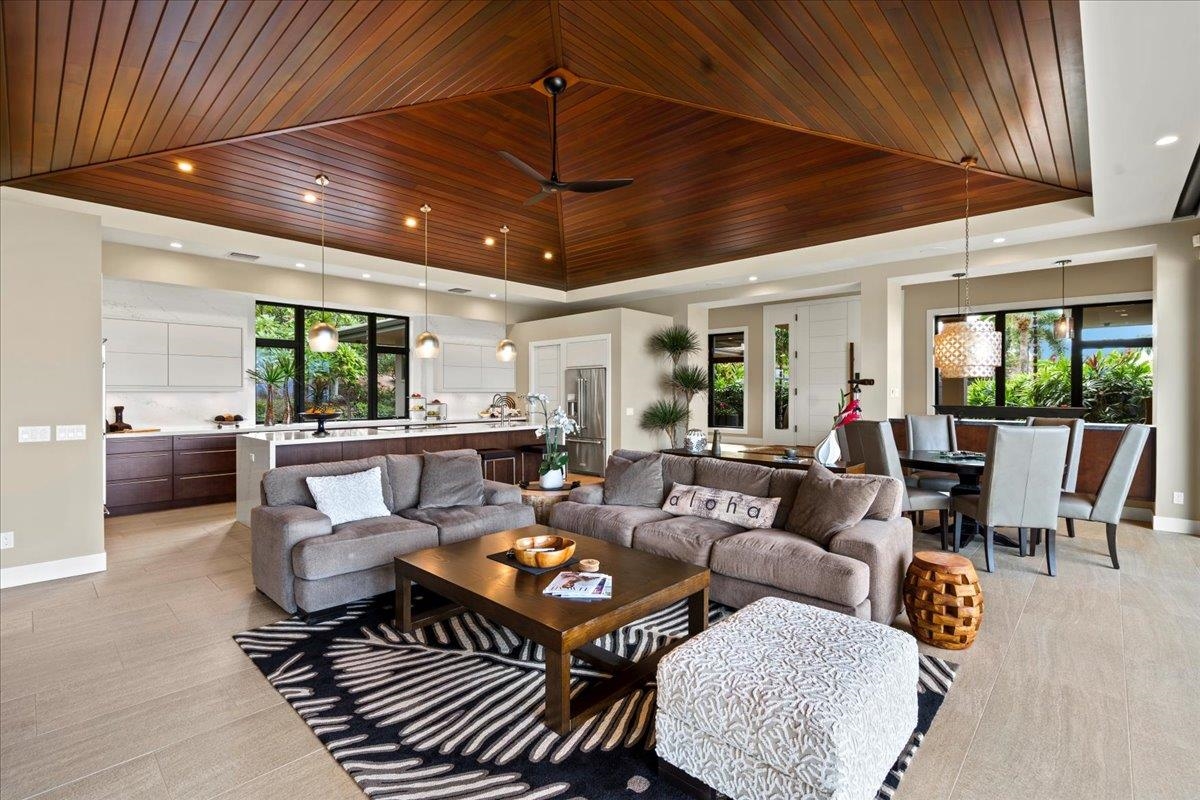 44 Anapuni Loop, Unit 3 Lahaina, HI 96761 - Photo 17 of 49 a living room with furniture and a large window