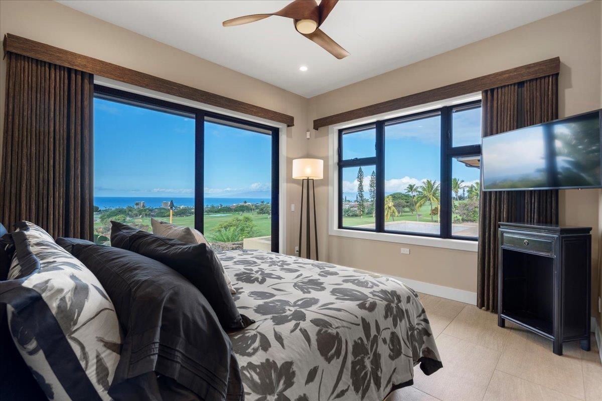 44 Anapuni Loop, Unit 3 Lahaina, HI 96761 - Photo 23 of 49 a bed sitting in a bedroom next to a window