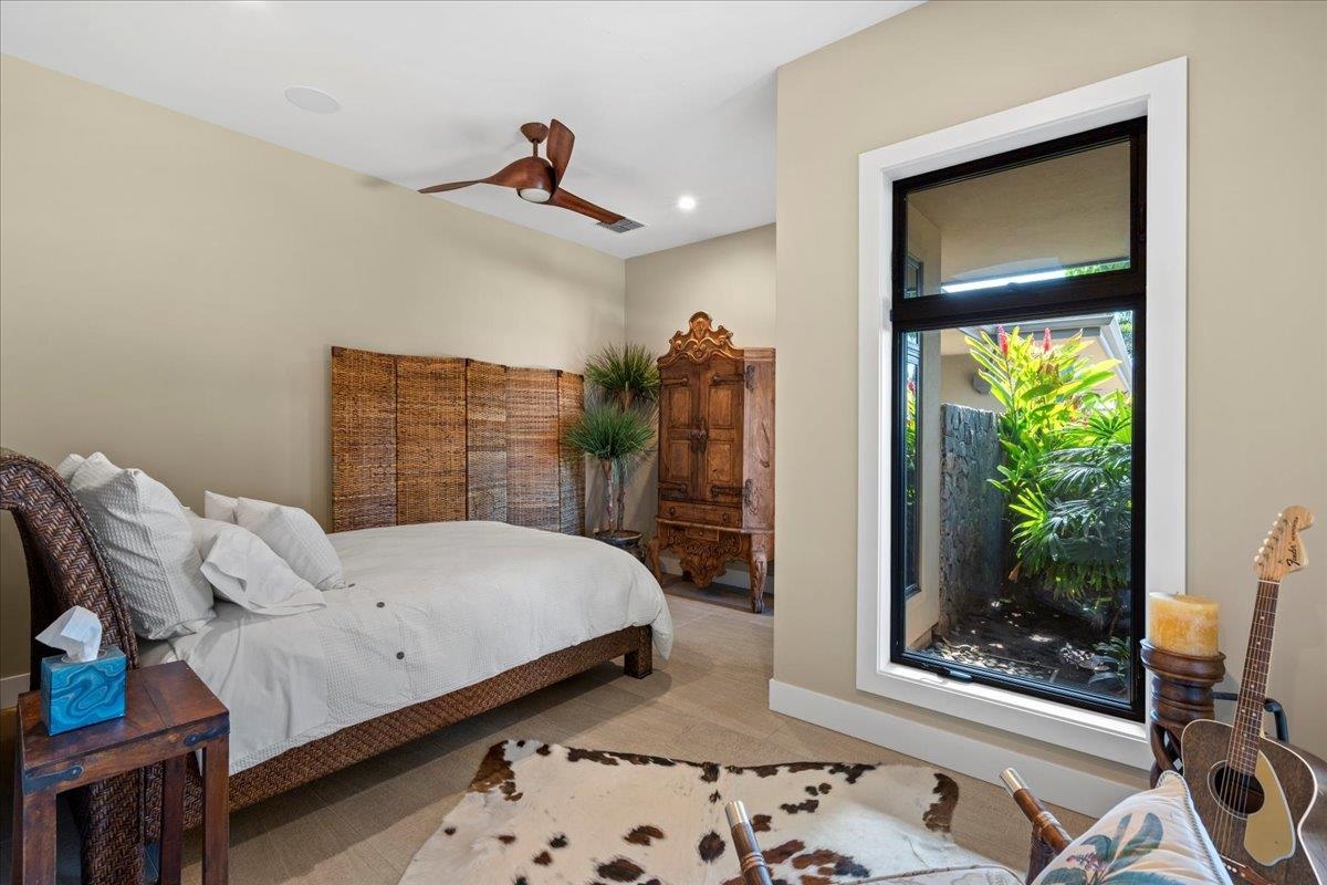44 Anapuni Loop, Unit 3 Lahaina, HI 96761 - Photo 26 of 49 a bedroom with a bed and a window