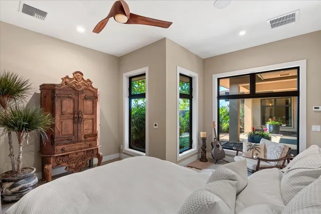 a bedroom with furniture and windows