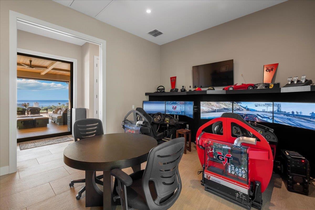 44 Anapuni Loop, Unit 3 Lahaina, HI 96761 - Photo 30 of 49 a living room with furniture and a flat screen tv