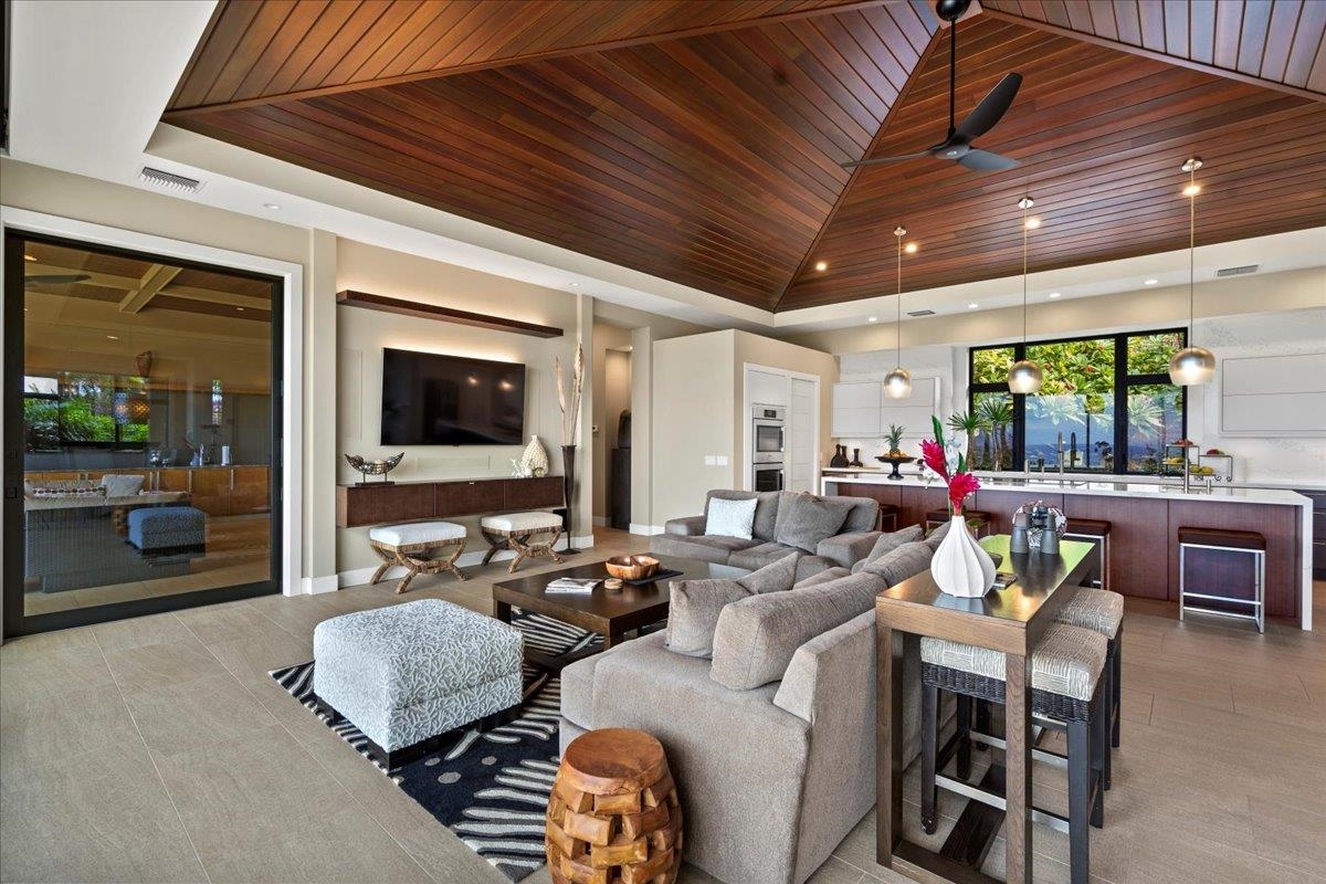 44 Anapuni Loop, Unit 3 Lahaina, HI 96761 - Photo 35 of 49 a living room with furniture and a flat screen tv