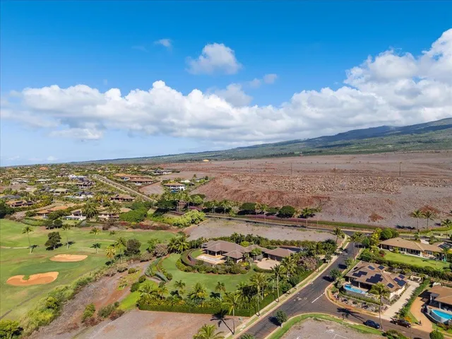 an aerial view of residential building and lake