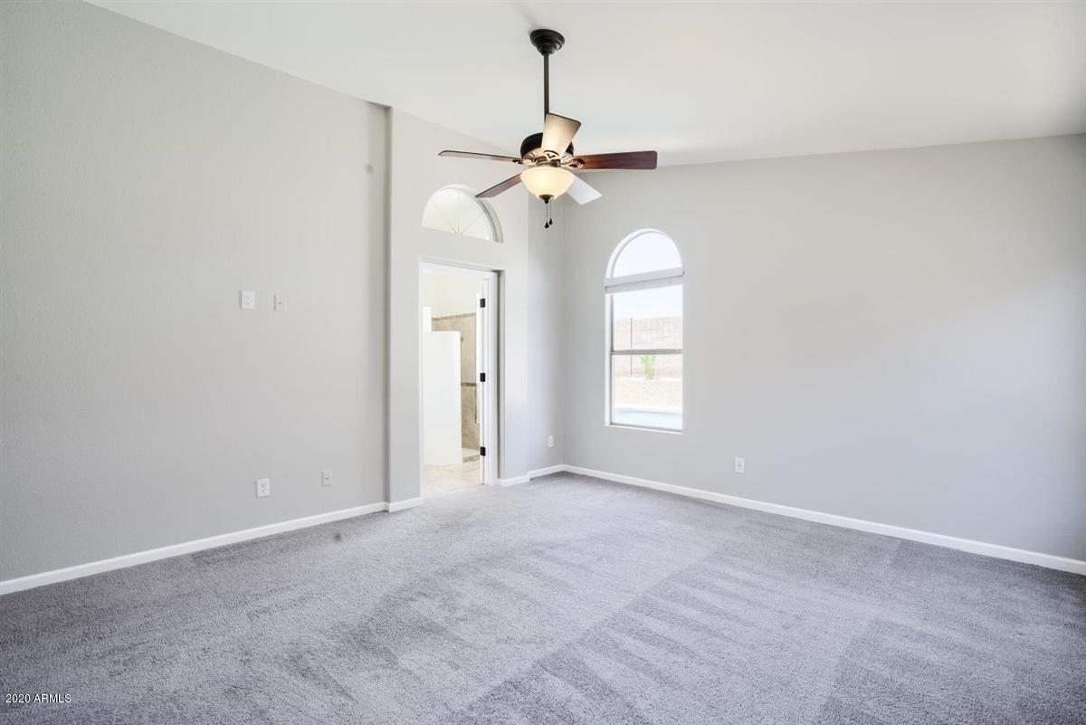 4606 East Weaver Road Phoenix, AZ 85050 - Photo 7 of 20 a view of a room with windows ceiling fan and hardwood floor