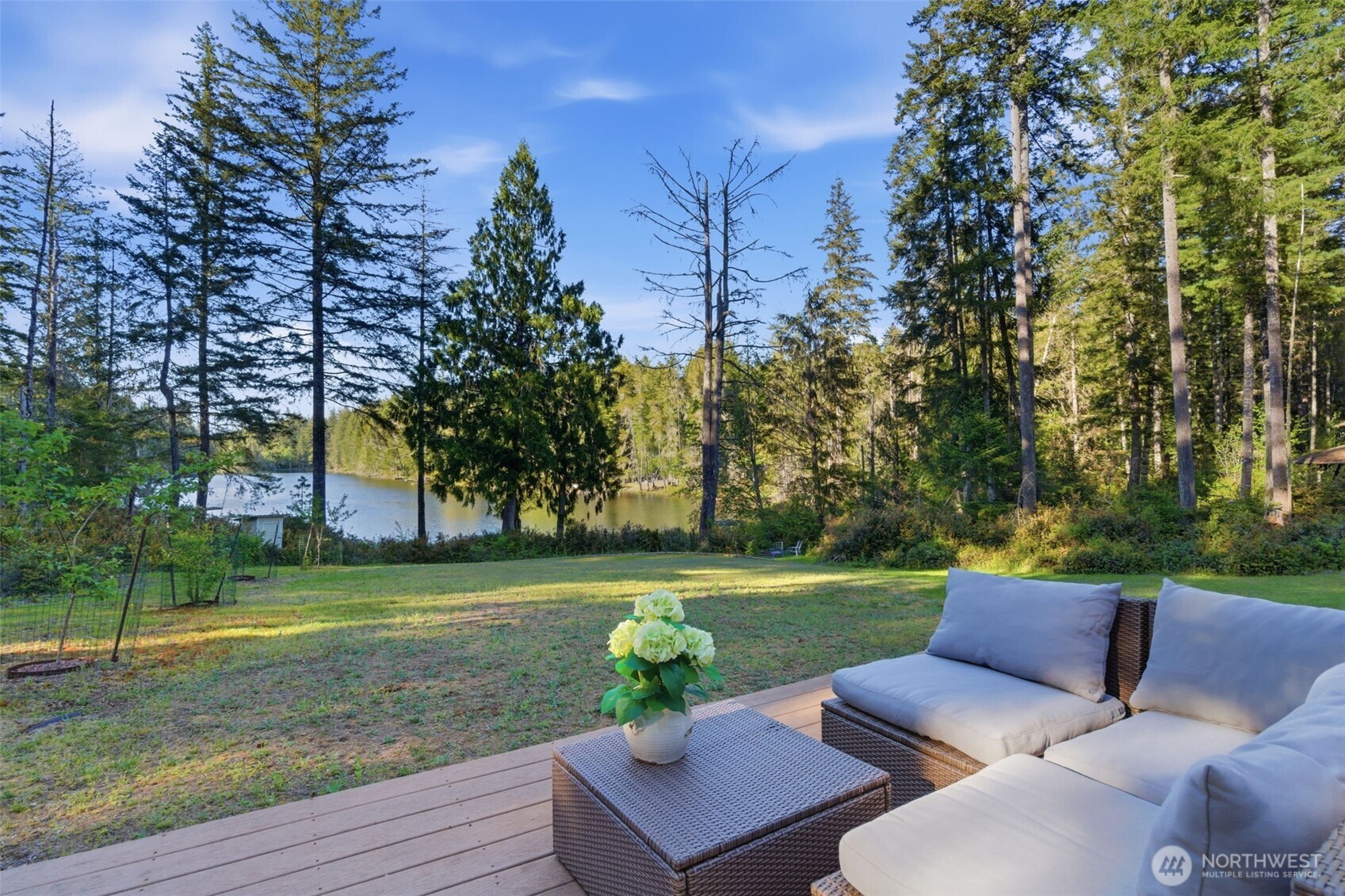 6971 Northeast Tahuya Blacksmith Road Belfair, WA 98528 - Photo 12 of 38 a view of a chairs and table in the garden