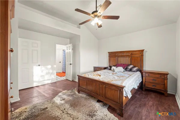a bedroom with a bed and a dresser