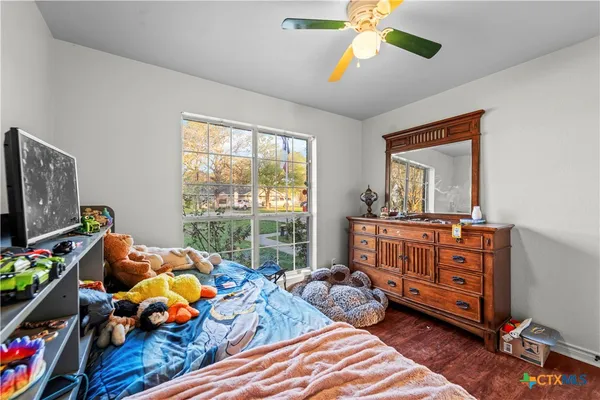 a bedroom with furniture and a window