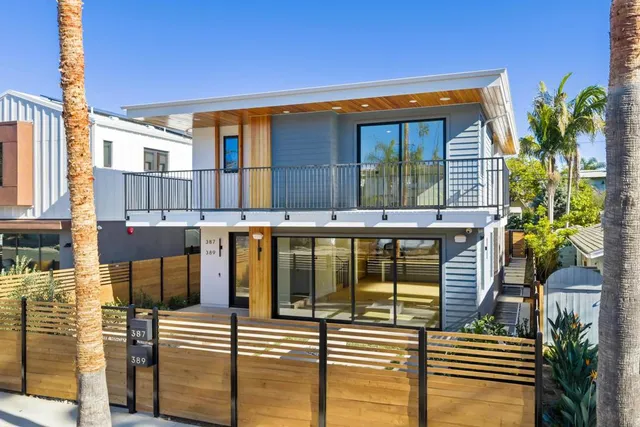 a front view of a house with glass windows
