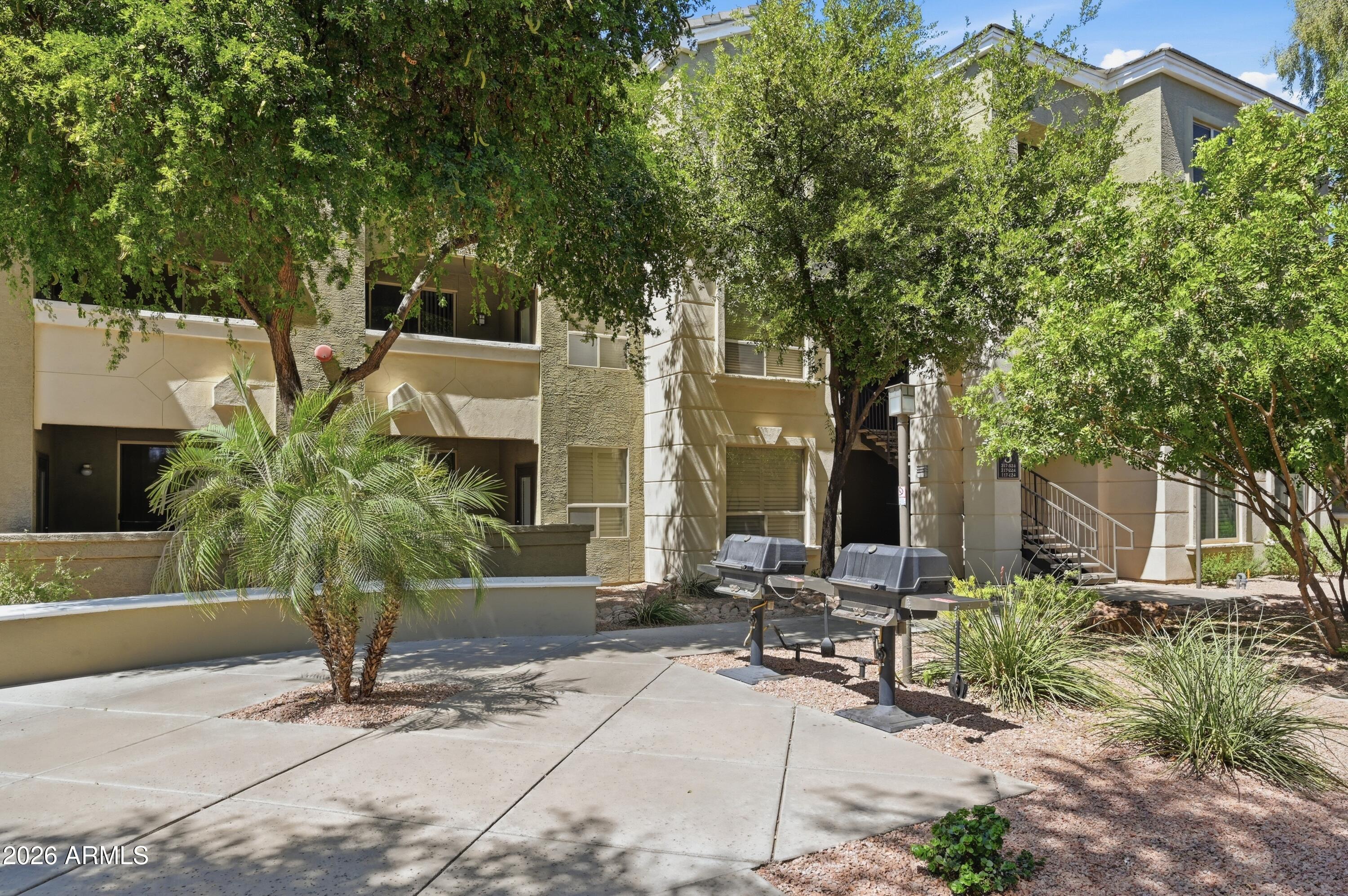 5303 North 7th Street, Unit 220 Phoenix, AZ 85014 - Photo 30 of 33 a view of backyard with outdoor seating and trees