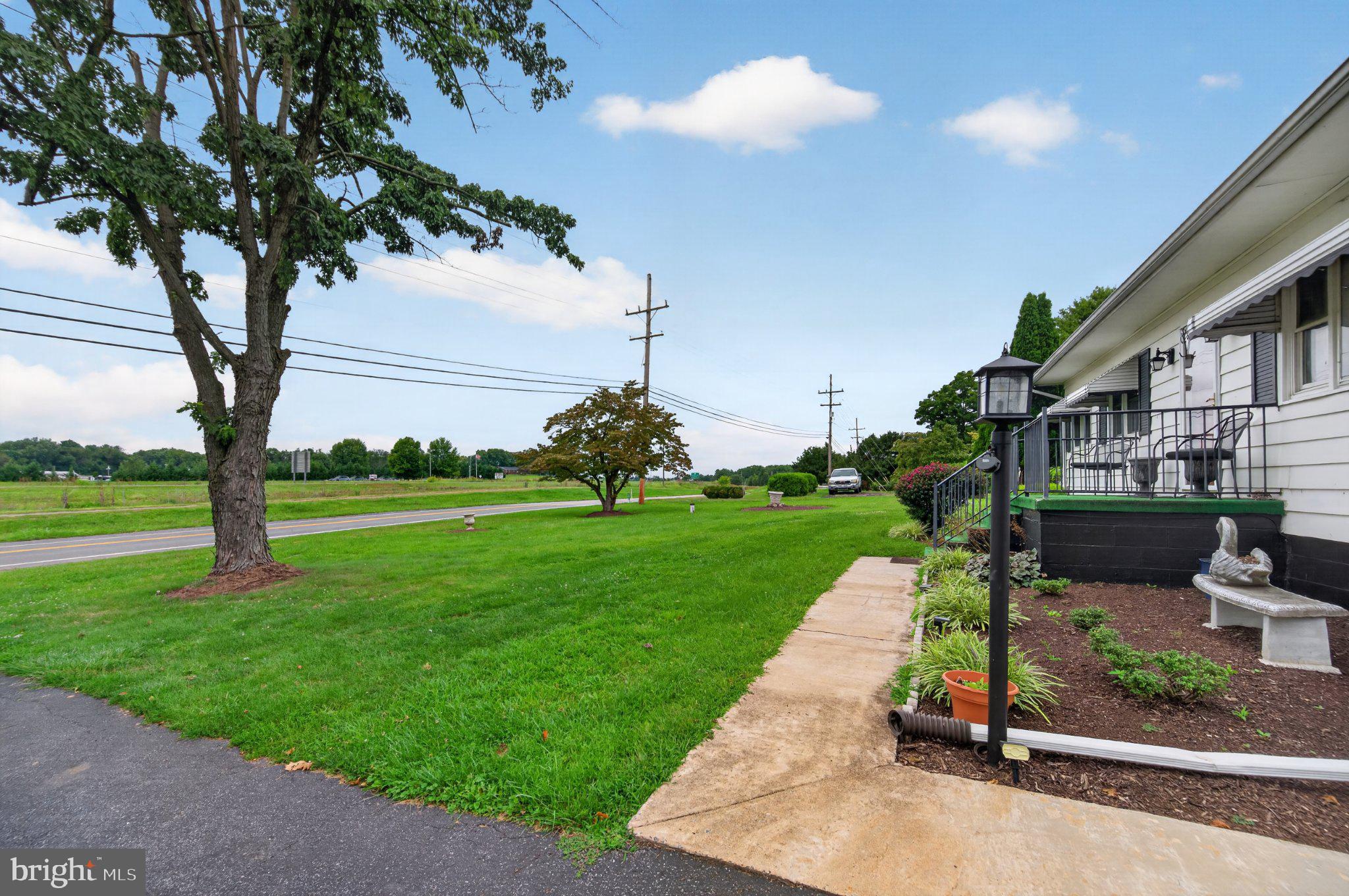 9005 Charles Town Road Ranson, WV 25438 - Photo 6 of 31 Spacious lawn with serene views.
