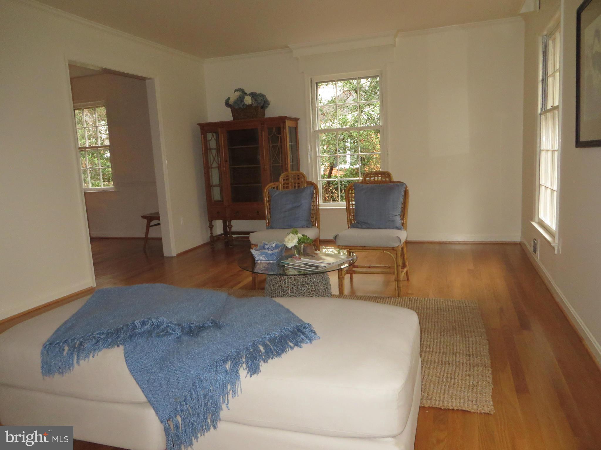 8425 Riverside Road Alexandria, VA 22308 - Photo 7 of 28 a living room with furniture and a wooden floor