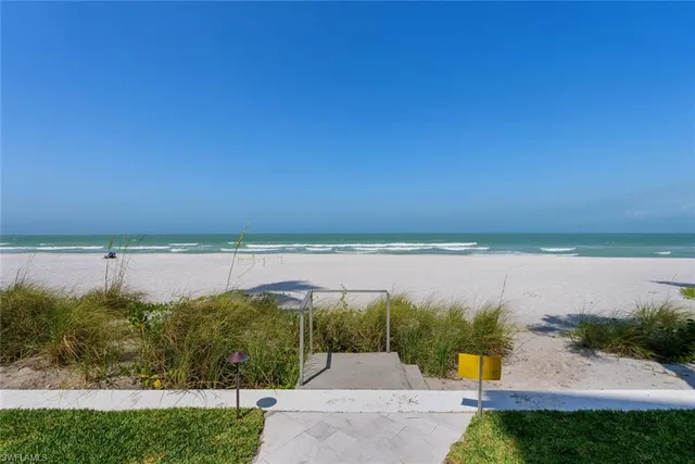 a view of a lake with a yard