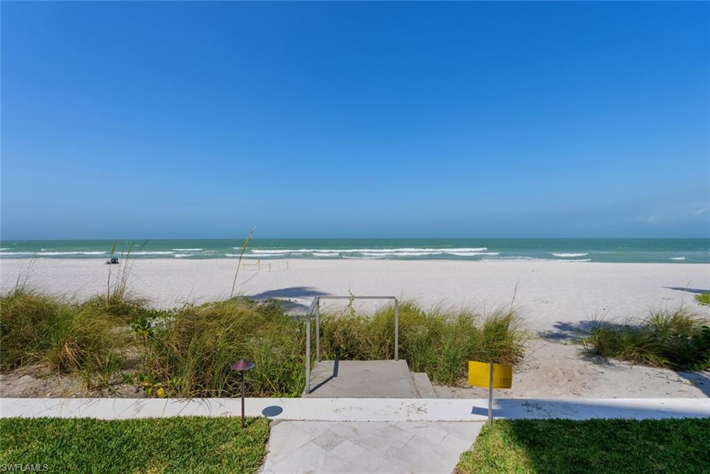 2011 Gulf Shore Boulevard North, Unit 45 Naples, FL 34102 - Photo 16 of 16 a view of a lake with a yard