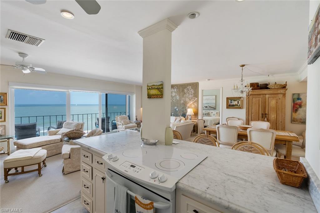 2011 Gulf Shore Boulevard North, Unit 45 Naples, FL 34102 - Photo 6 of 16 a view of a living room and dining room