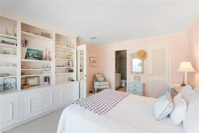 a bedroom with a bed and a cabinets