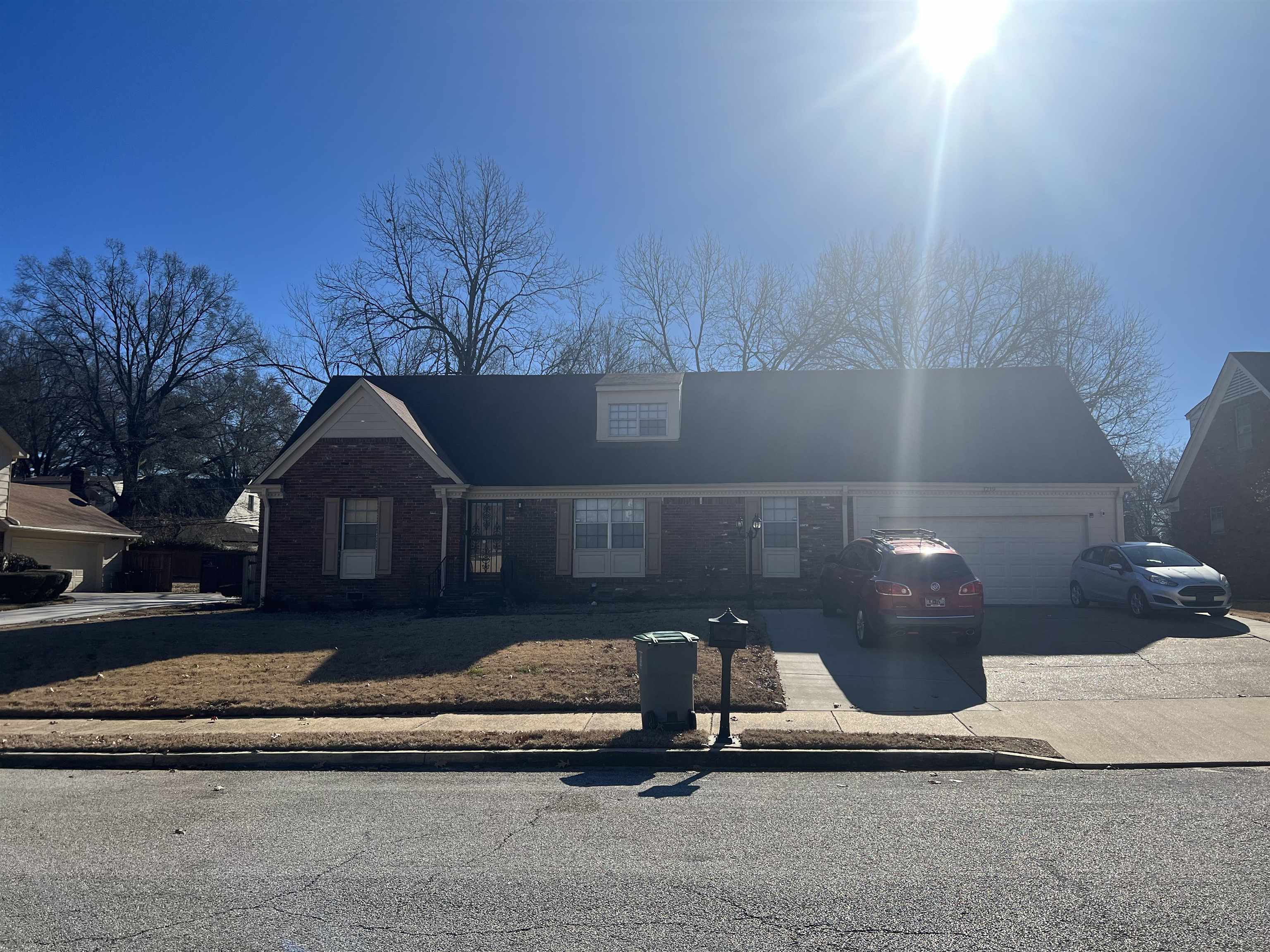 1219 Hester Road Memphis, TN 38116 - Photo 1 of 2 a front view of a house with a yard