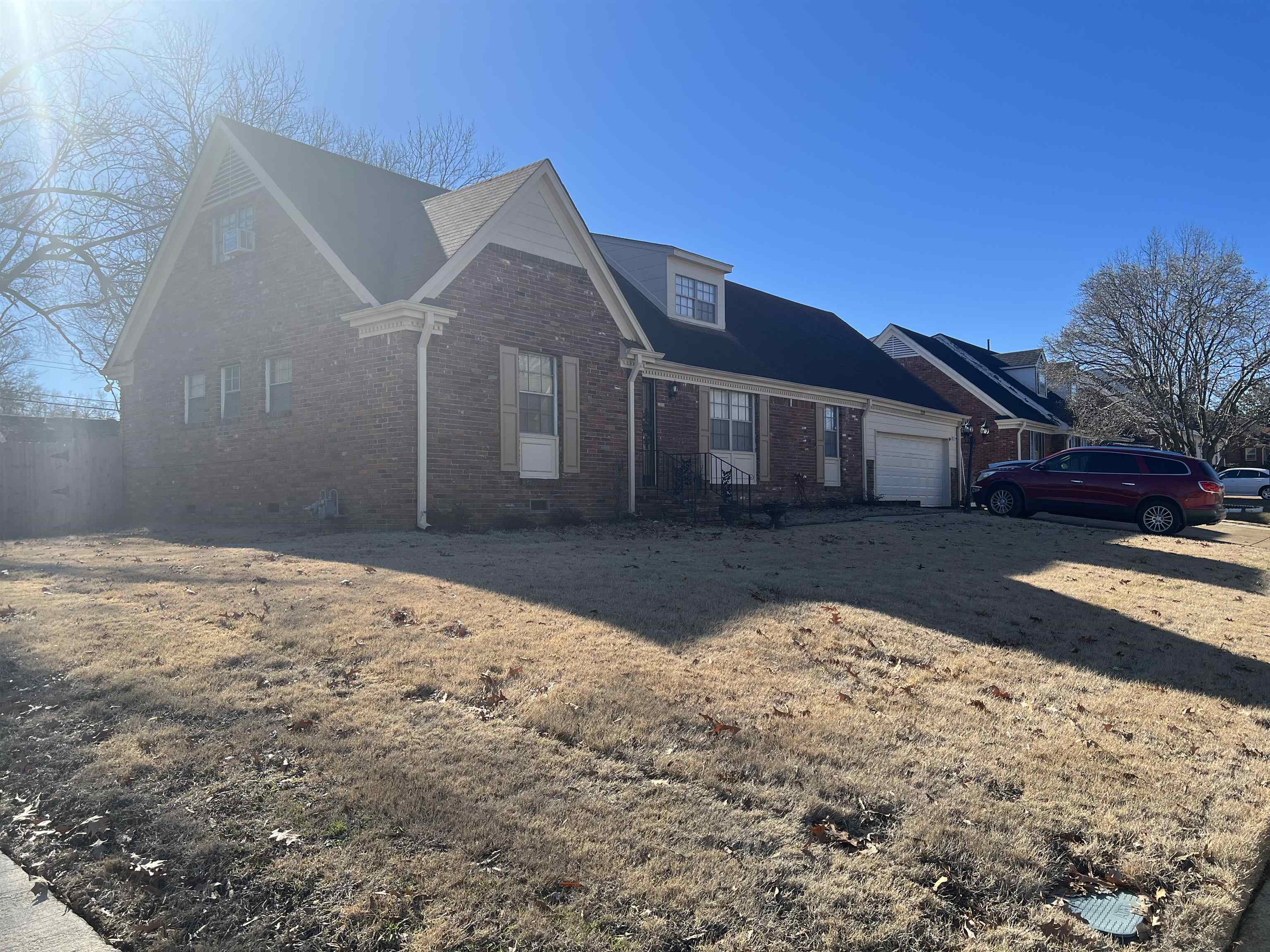 1219 Hester Road Memphis, TN 38116 - Photo 2 of 2 a front view of a house with a yard